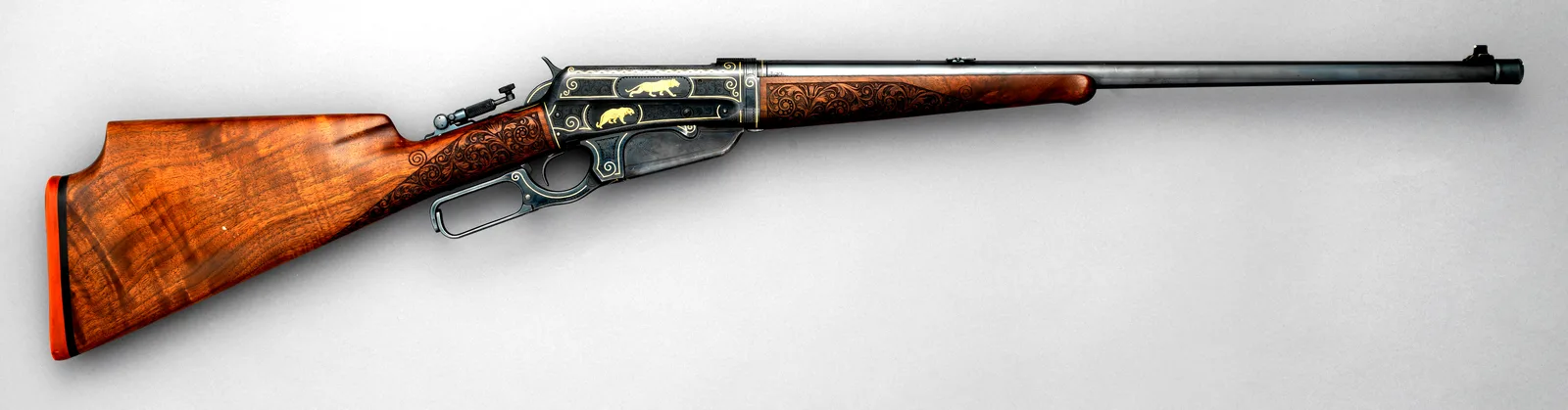 Winchester Model 1895 takedown rifle made in 1913, right side, with engraved receiver.